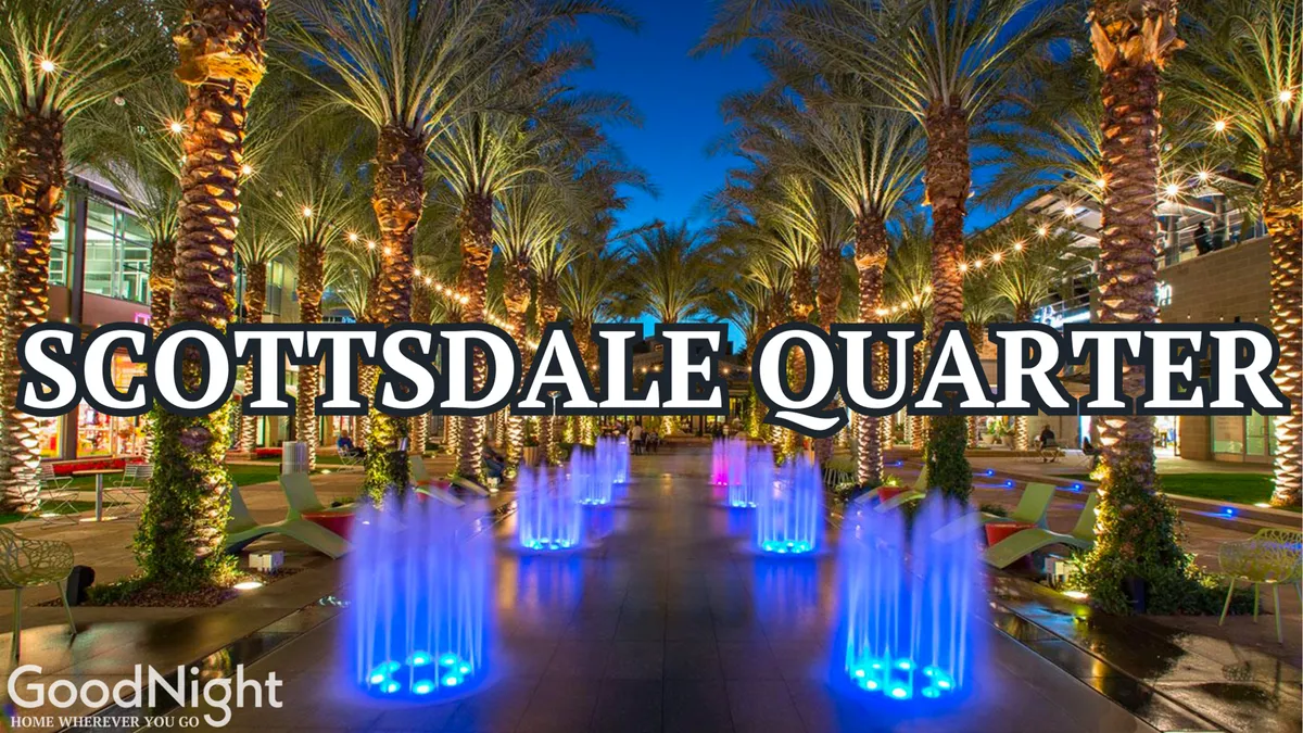 The scene showcases a modern plaza with palm trees, colorful illuminated fountains, and sleek architectural elements. People are seen walking, dining, and mingling in a festive setting that transitions beautifully from day to night.